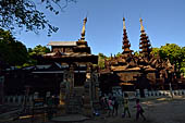 Old Bagan Myanmar. The Nat Taung monastery complex. The spires above the shrine rooms, below a masonry wall.  